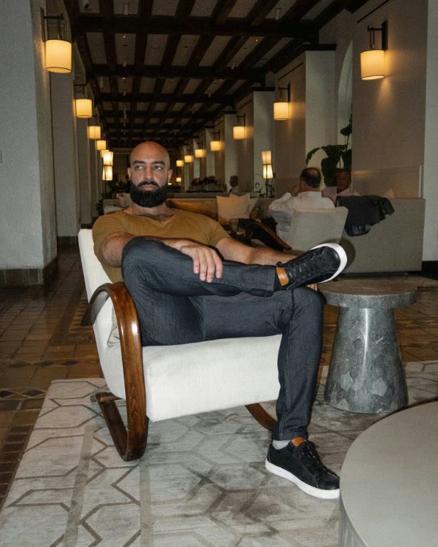 Sameem Rouhanifard seated in a hotel lobby